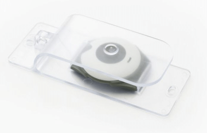 Clear EasyPress adapter fitted over a telecare alarm button